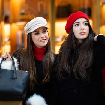 two-attractive-smiling-young-women-are-shopping-city_53419-8793